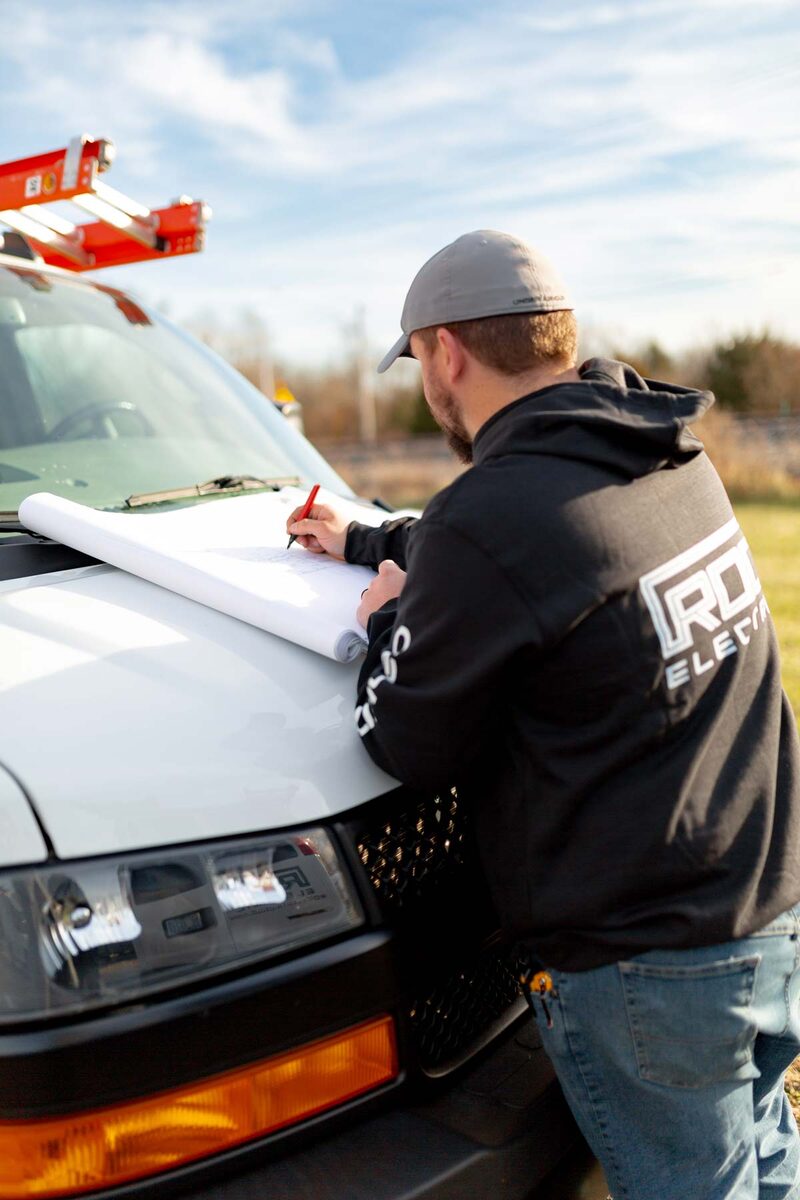 ROC Electric electrician planning a job at the truck
