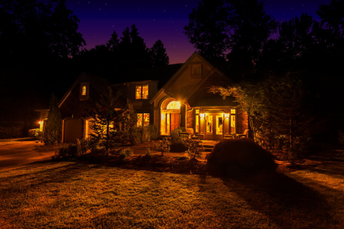 cozy home at night powered by residential standby generators