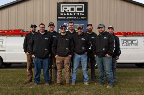 roc elcetric team members outside building